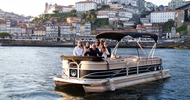 Private pontoon boat cruising on the Douro River in Porto