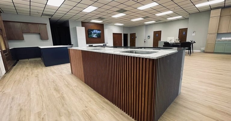a kitchen island with a counter top and a bar top