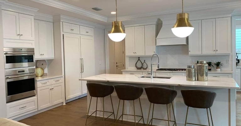 a kitchen with a large island and a bar stool