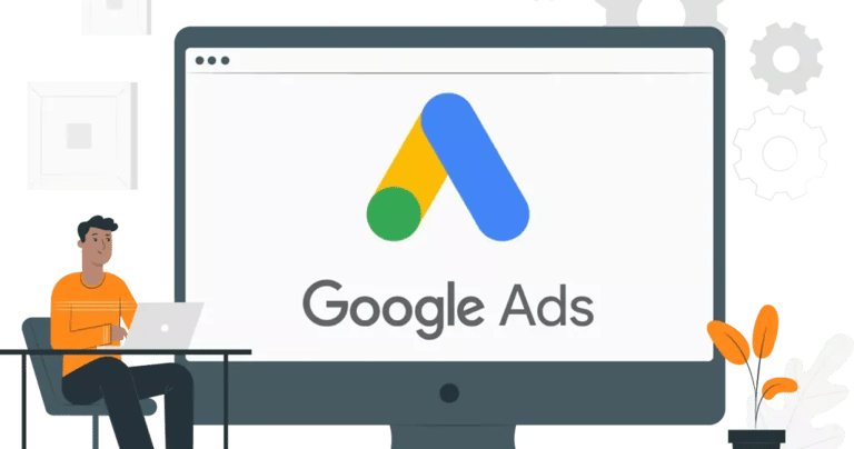 a man sitting at a desk with a laptop looking at google ads logo on the screen