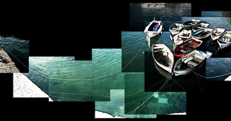 A joiner of small row boats tied together in beautiful Cornish water