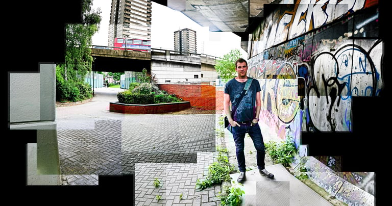 A joiner of a person standing next to a wall with graffiti sprayed on it in the inner city