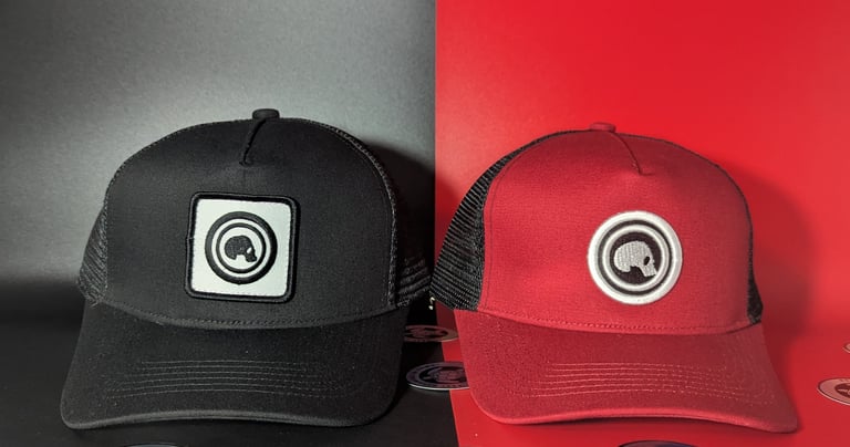two hats with a camera on a table