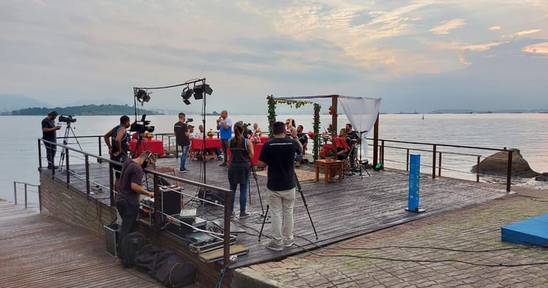 a group of people standing on a pier
