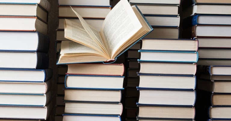 An open children's book showing a vibrant, whimsical illustration of animals in a forest.