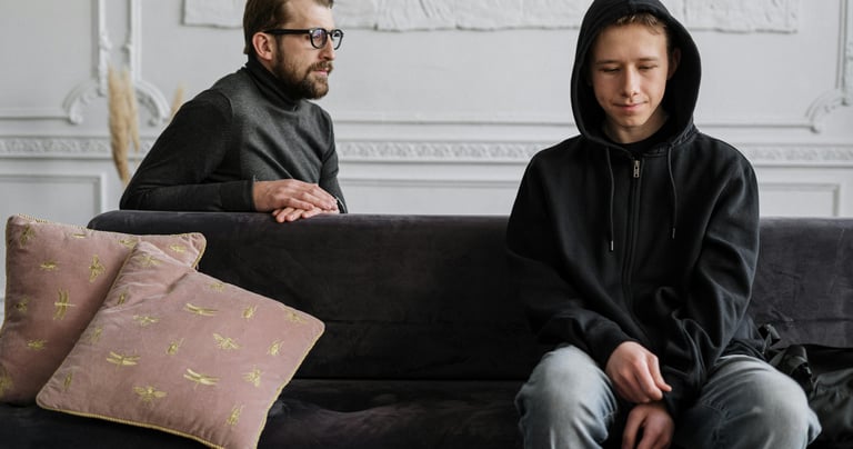 a man and woman sitting on a couch