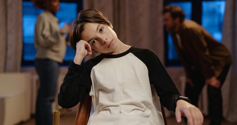 a woman sitting in a chair with a man in a chair