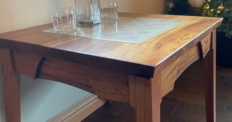 An oak coffee table with chess board inlay