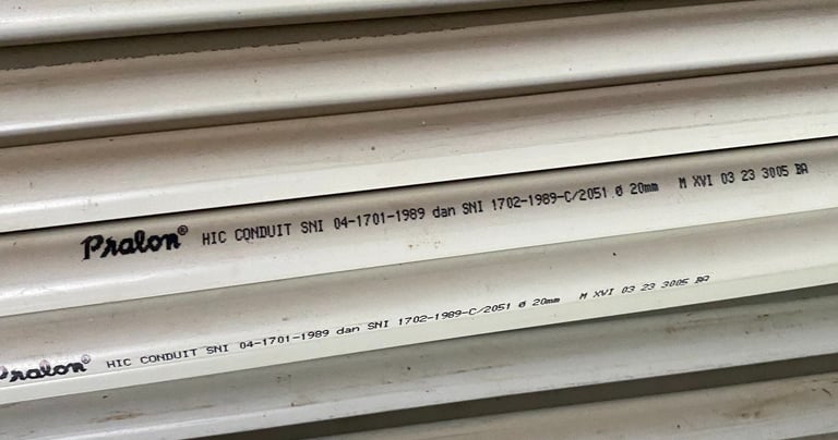 a stack of pipes and pipes in a warehouse HIC High impact Conduit Distributor Pralon