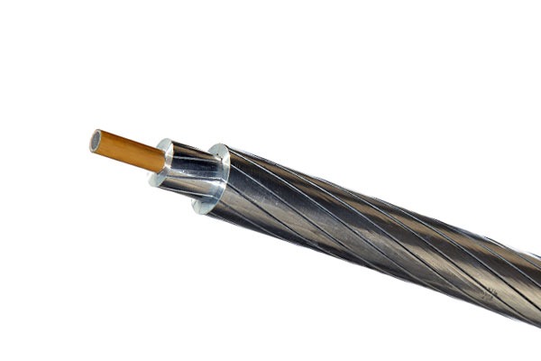 a close up of a black and white cable wire with a brown cable Kabel Metal Indonesia