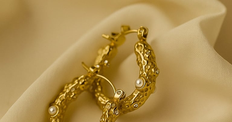 a pair of gold earrings with pearls and pearls, gold