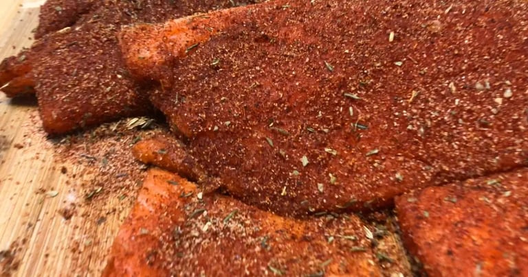 blackened seasoning rubbed on steelhead trout fillets.