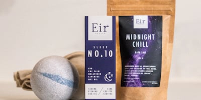 Several wellness products are arranged on a surface. There is a box labeled 'Eir Health Sleep No. 10