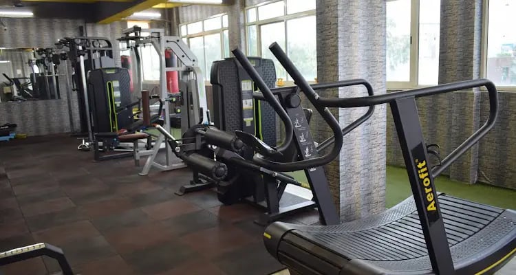 a gym room with a tread tread machine