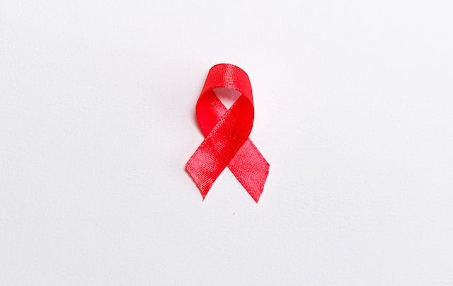 a red ribbon with a red ribbon around it