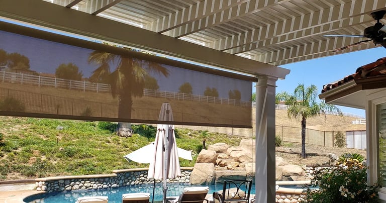 Drop shade installed on patiocover with veiw of pool.