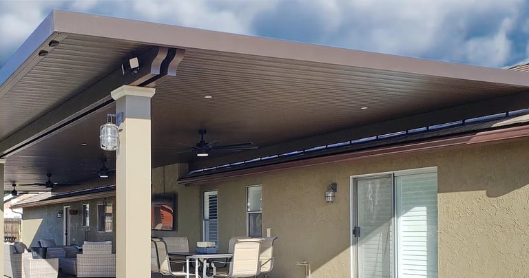Large Alumawood patio structure mounted to top of tile roof.