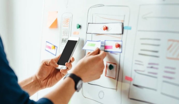 https://www.shutterstock.com/image-photo/web-designer-planning-application-mobile-phone-622216766