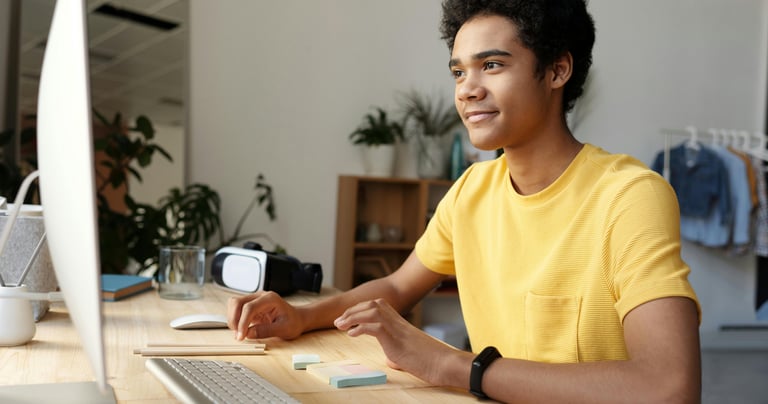 a student happily engaged in an online physics class