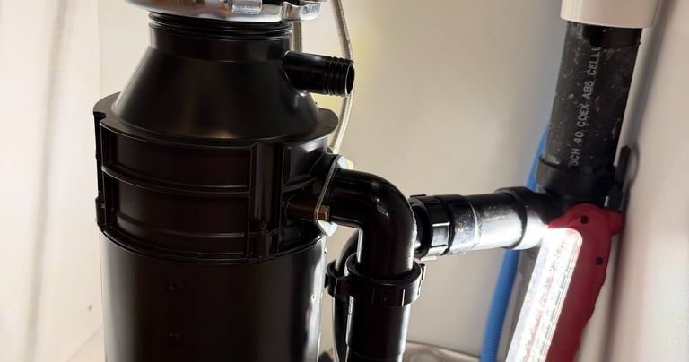 installing a new garbage disposal under a sink in Glendale