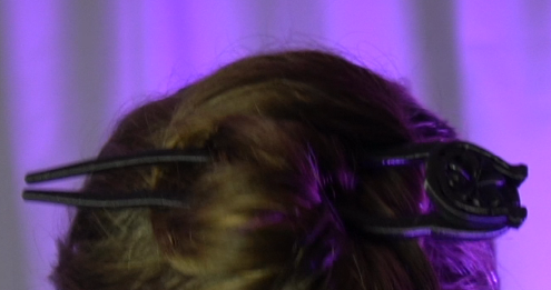 a woman with a pair of scissors and a pair of scissors