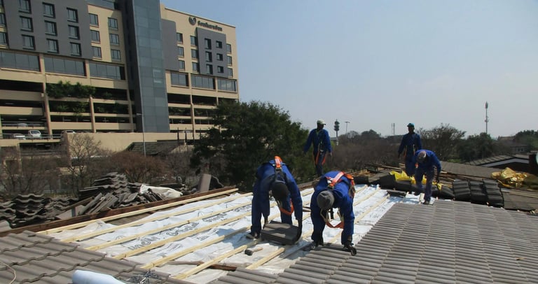 Laying roof tiles for roof installation Project, Environmental Pro Construction