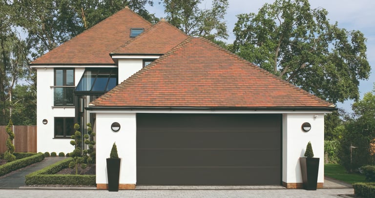 front of a house with a grey garage door