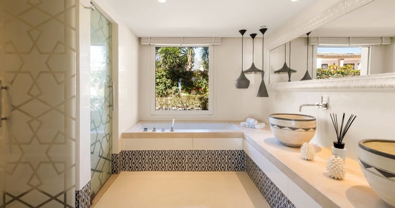 Sleek, modern guest bathroom featuring geometric patterns at Villa El Rincon.