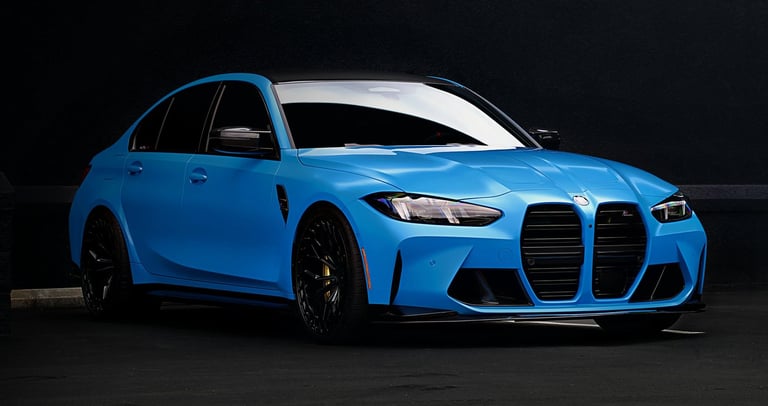 Electric blue BMW M3 Competition XDrive car photography at 704 Exotics in Charlotte, North Carolina.