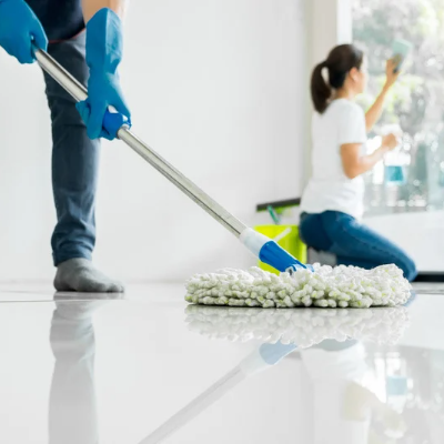 mopping a floor in an empty room and cleaning the window