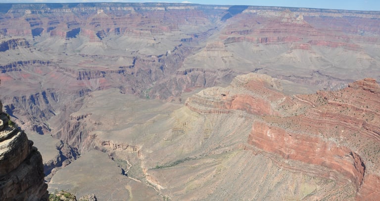 on a cliff overlooking the grand canyon