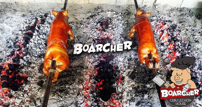 2 lechons being roasted