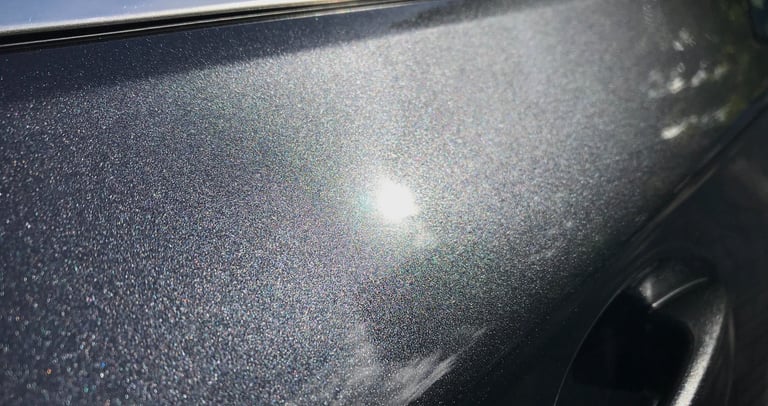 a car with a shiny silver paint job