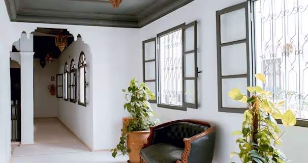 room with many windows and a traditional design.