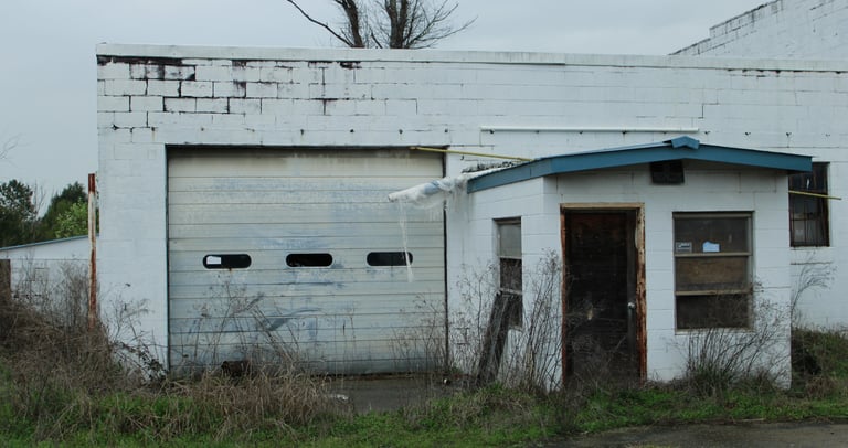 Moody blue photograph of abandoned garage