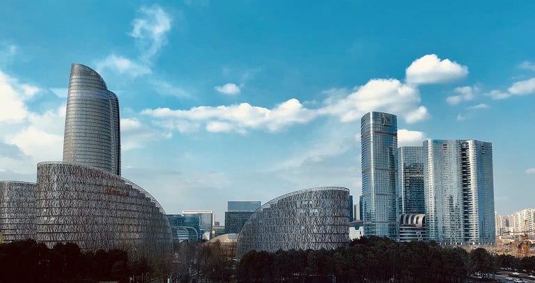 a city skyline with skyscrapers and a river