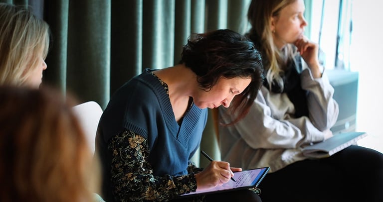 Me writing on my tablet in consultation with our project target croup people. 