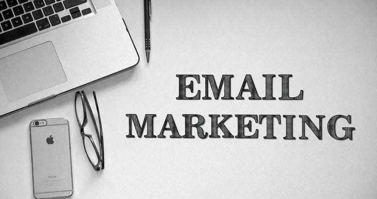 Minimal black and white workspace illustrating email marketing strategy.