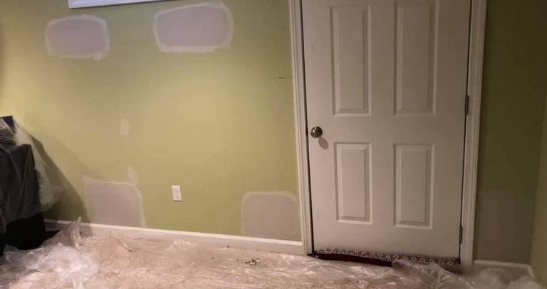 drywall repairs on a green wall smooth patching