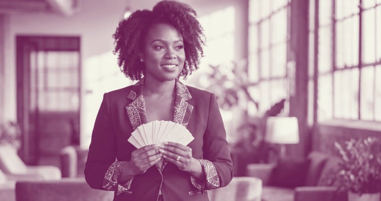 A black woman holds a fan of business cards in her hands