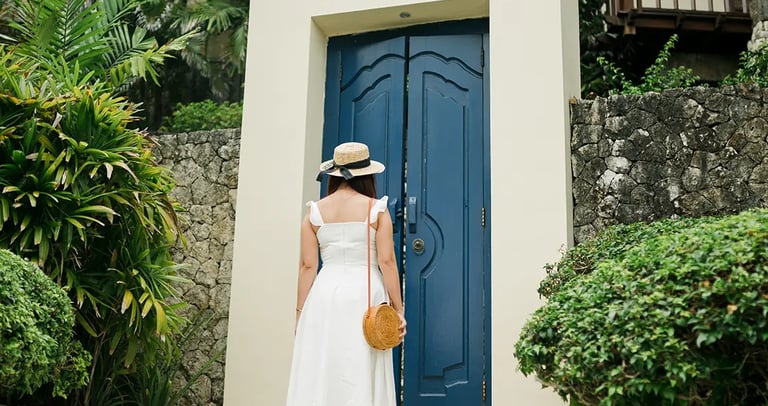 Selly standing near the tropical villa entrance at Karma Kandara Uluwatu Bali  