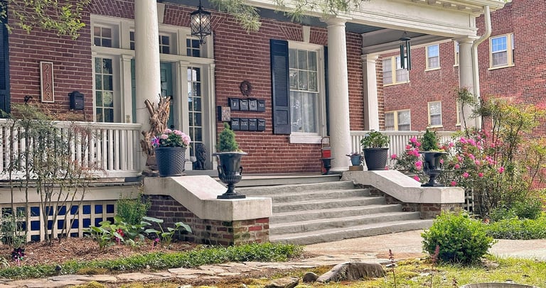 a house with a porch and steps leading up to a porch