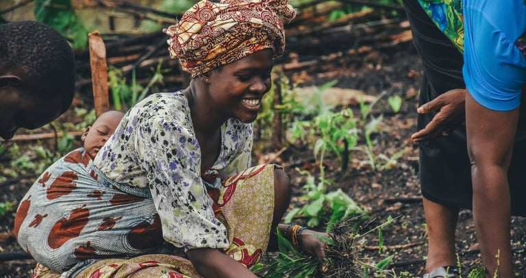 Lady farming with baby