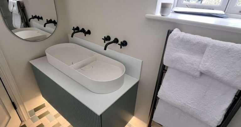 Elegant bathroom renovation with corner shower and chrome fixtures in Evesham        Ask ChatGPT