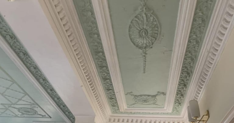a ceiling painted white and green by pbp services at a home in pershore
