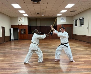practicing kenjutsu with long and short bokuto in Mount Pleasant dojo