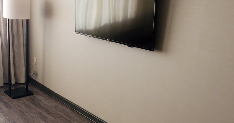 TV mounted on wall in a hotel room