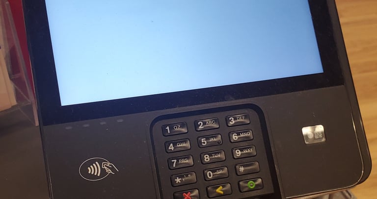 point of sale  pin pad on retail counter