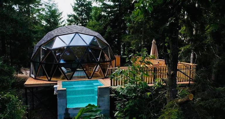a dome shaped pool with a pool and a deck