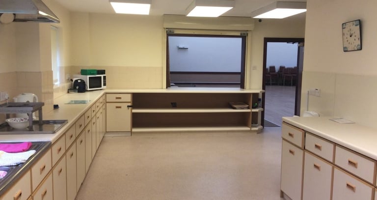 a kitchen with a large window and a sink